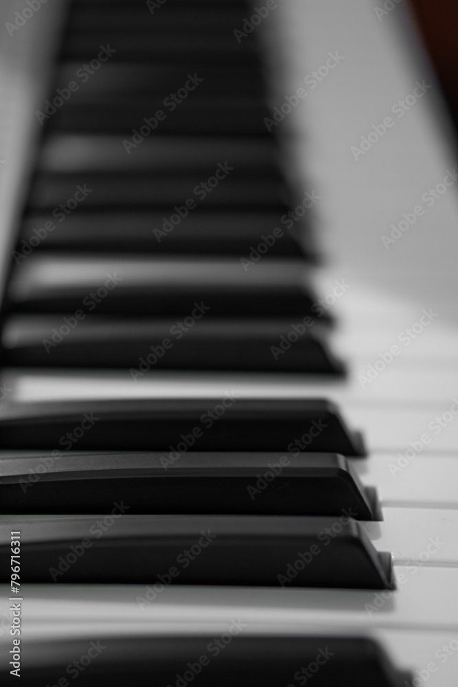 piano keys, blurred background in the distance piano keys, blurred background in the distance