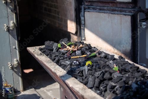 Obraz na plátně The crematory tray with incense sticks, flower and charcoal from cremate funeral human body cremation ceremony of religion buddhist in temple of Thailand