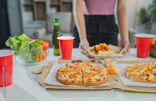Savor a delicious slice of Italian pizza, baked to perfection with mozzarella, ham, pineapple, and pepperoni. Enjoy it at a rustic restaurant or homemade at your kitchen table.