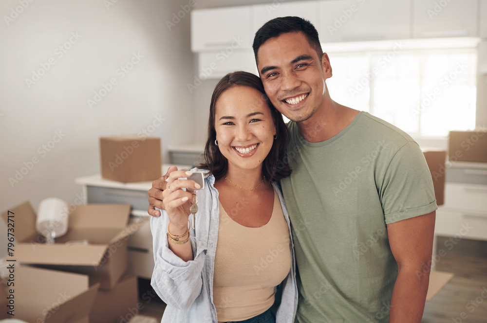© peopleimages.com - Portrait, couple and happy in new home with boxes for moving in, satisfied and confident with ownership. Real Estate, relationship and smile with unpacking furniture, excited and positive on property