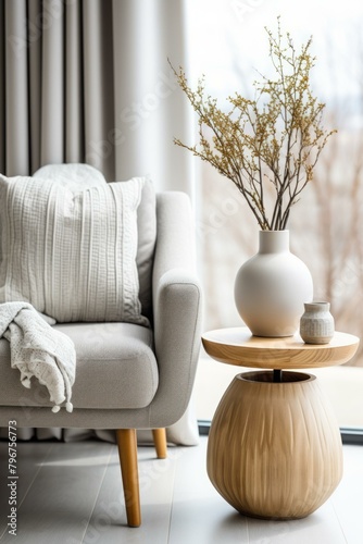 b A Stylish Living Room With A Comfortable Chair And A Wooden Table 