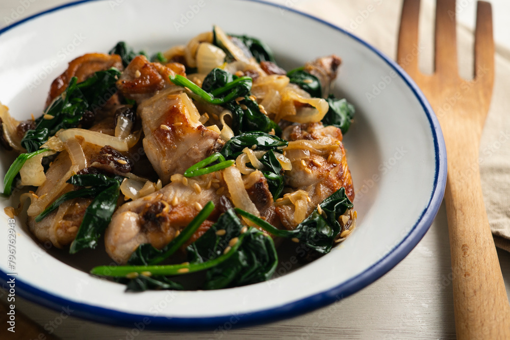 Recipe for fried rabbit with spinach and raisins. Traditional tapa from northern Spain. Recipe for fried rabbit with spinach and raisins. Traditional tapa from northern Spain.