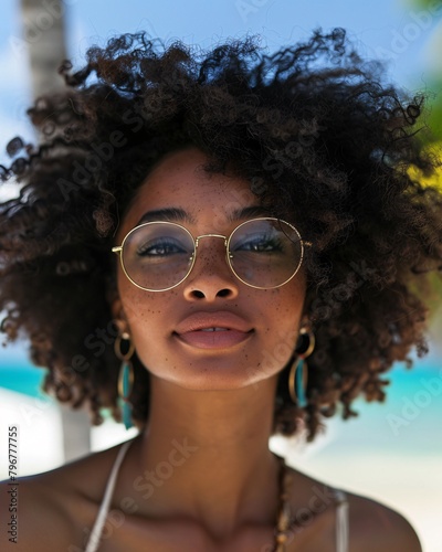 Portrait of black woman in sunglasses on summer vacation