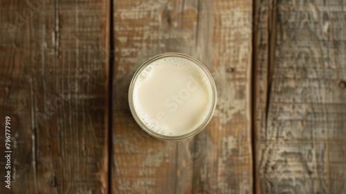 Top view of a glass of delicious white milk on a wooden table. Generated AI image
