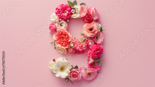 Top View Pink Floral Number Nine. Top view of number 9 floral arrangement on pink background for celebrations.