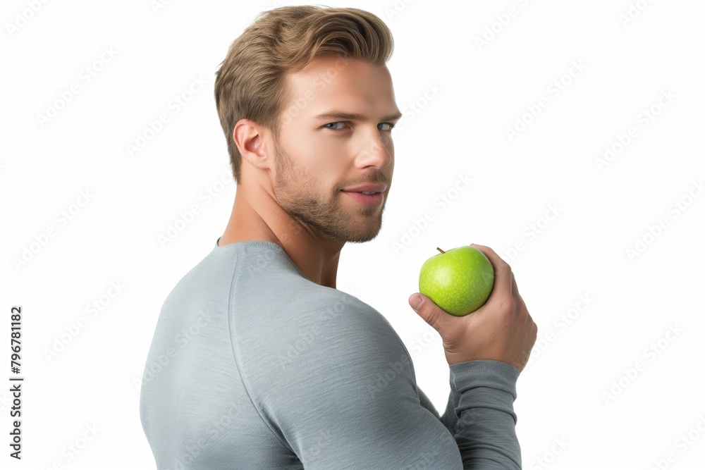 Man with green apple against white Man with green apple against white