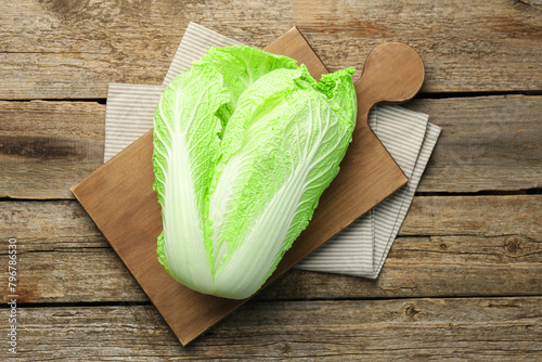 Fresh ripe Chinese cabbage on wooden table, top view photo