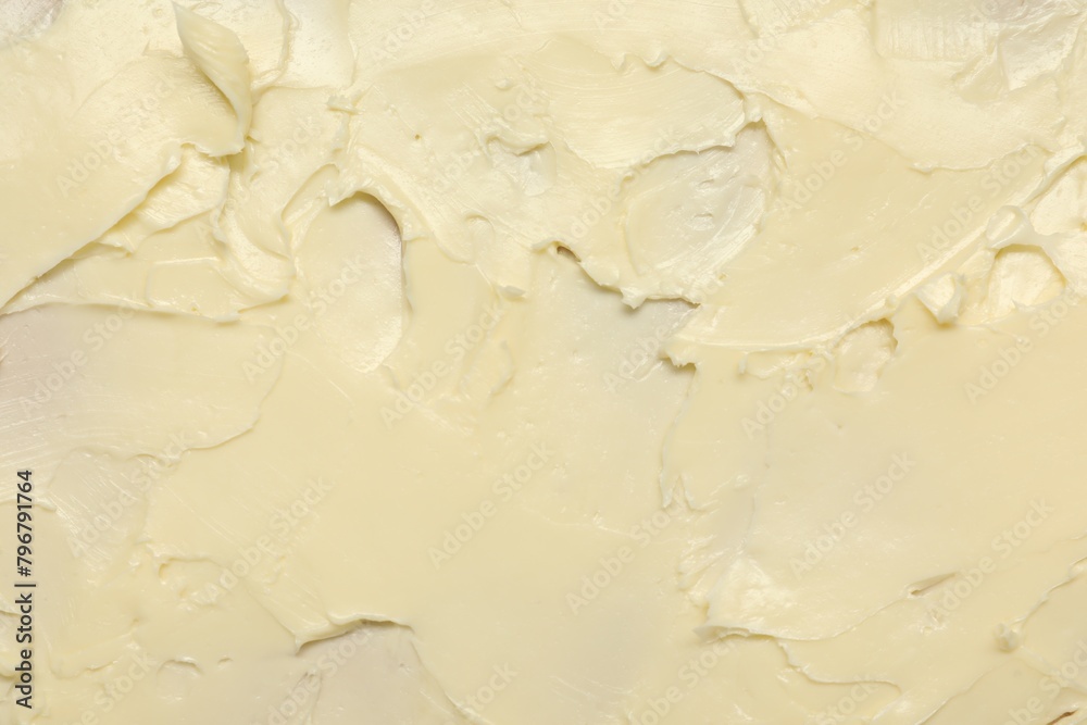Obraz premium Texture of fresh natural butter as background, top view