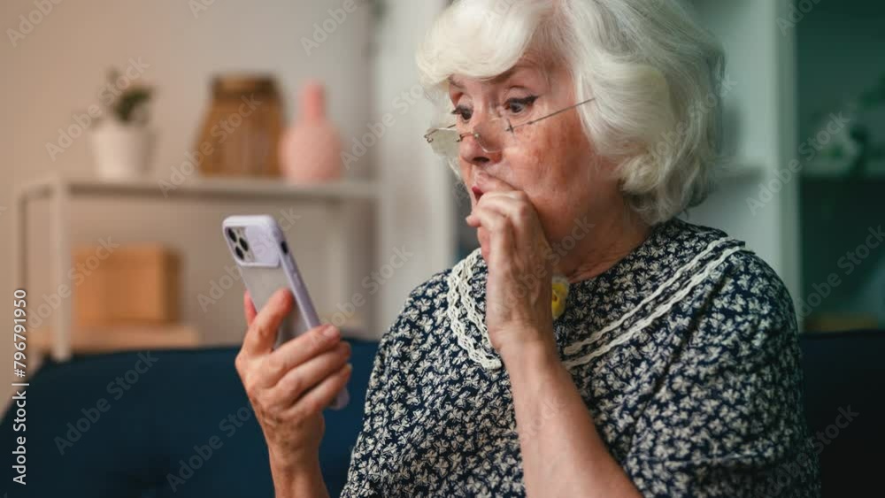 Aged woman feeling shocked by declined payment on cellphone, online app problem Aged woman feeling shocked by declined payment on cellphone, online app problem