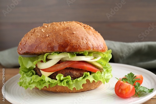 Delicious vegetarian burger on table, closeup view