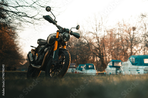 Scrambler motorcycle at sunset, cafe racer style retro motorbike wallpaper
