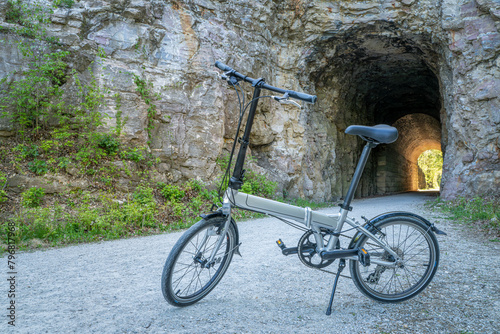 Folding bike on Katy Trail at a tunnel near Rocheport, Missouri, spring scenery. The Katy Trail is 237 mile bike trail converted from an old railroad. photo