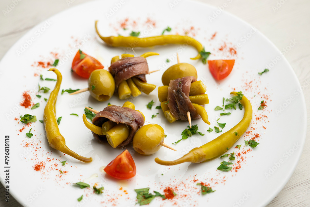 Gilda is a traditional pincho or tapa from the Basque Country that is prepared with anchovies, olives and pickled chillies.