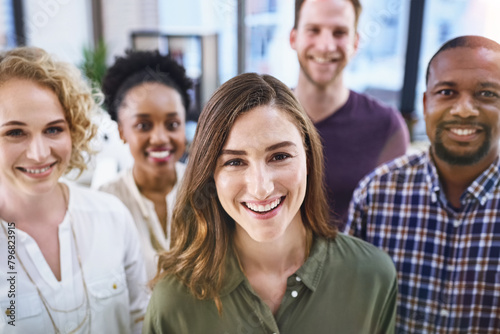 Happy woman, portrait and office with creative team in business startup, growth or diversity. Female person, employee or positivity with smile in multicultural group, unity or about us at workplace