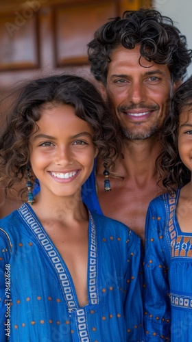 A man with two girls in blue dresses smiling for the camera, AI