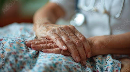 A doctor holds an elderly patient's hands