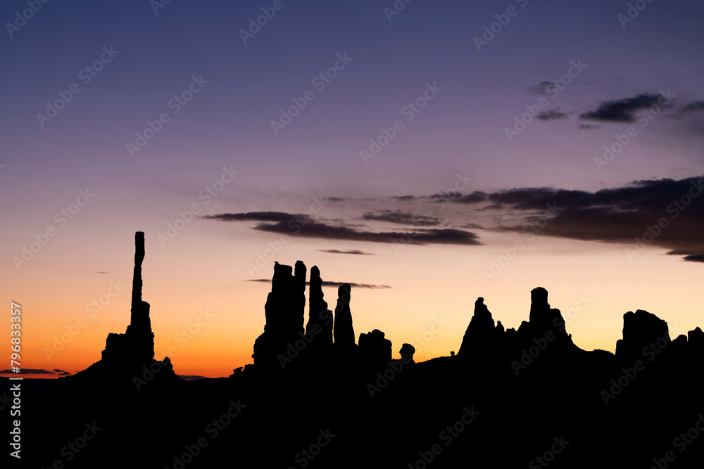 Totem Pole against other spires in Monument Valley during sunrise. Totem Pole against other spires in Monument Valley during sunrise.