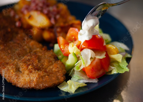 breaded pork and salad