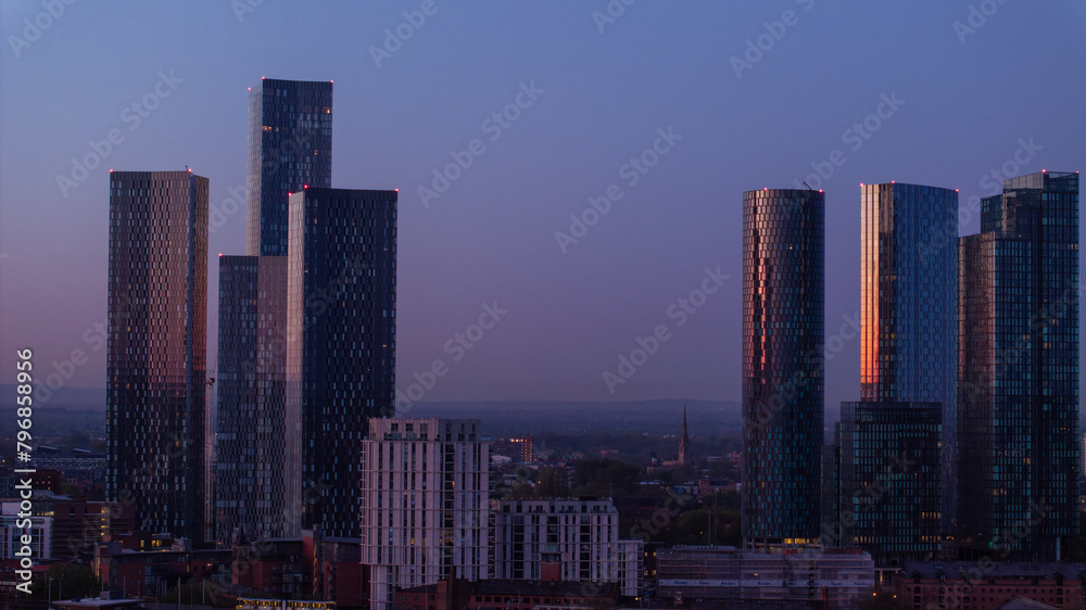 Fototapeta premium Manchester Twilight skyline with illuminated skyscrapers