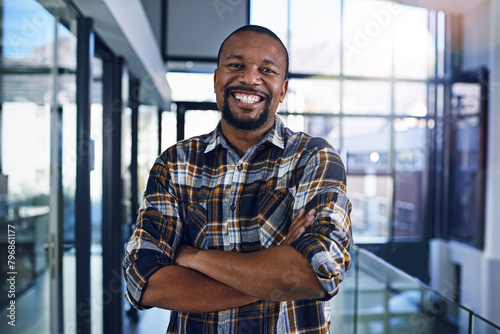 Office, crossed arms and portrait of business black man with company pride, confidence and smile. Creative startup, professional and happy person for career, work opportunity and job in workplace photo