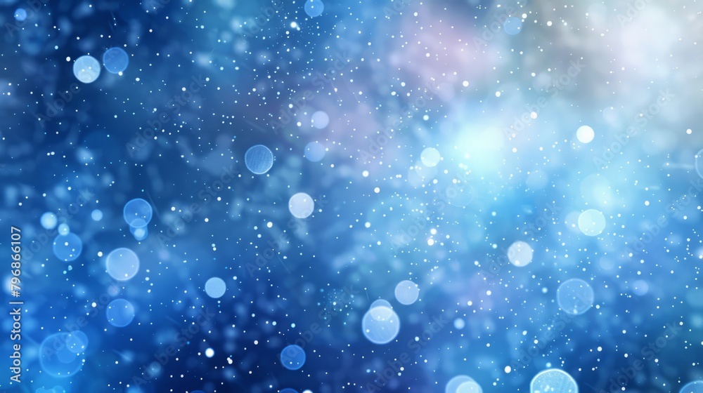 Blue winter background with falling snow and bokeh