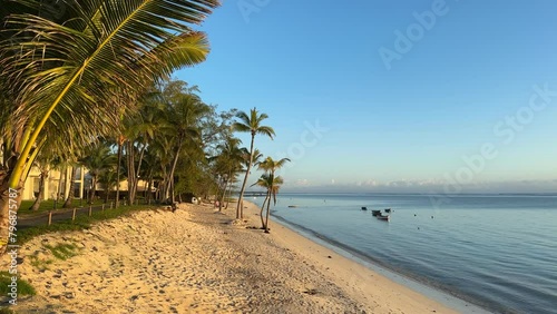The deserted beach on the island of Mauritius on the beach of a hotel complex at sunrise. The beautiful and untouched nature