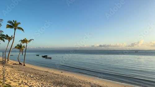 The deserted beach on the island of Mauritius on the beach of a hotel complex at sunrise. The beautiful and untouched nature