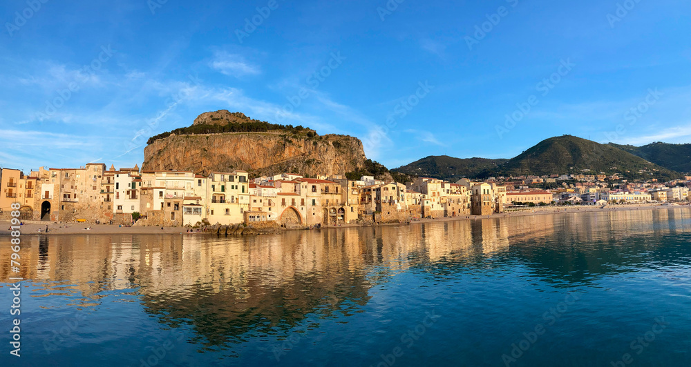panorama old town of Cefalu with beach on background of mountain
