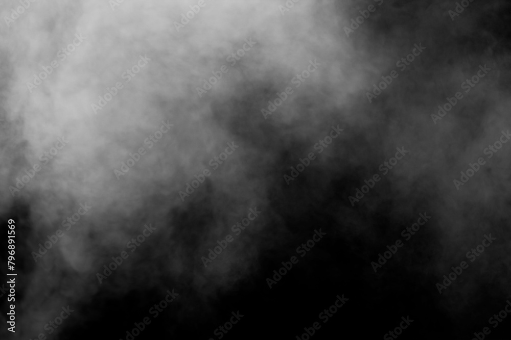 Isolated white fog on the black background, smoky effect for photos and artworks. Smoke and powder overlay on black background