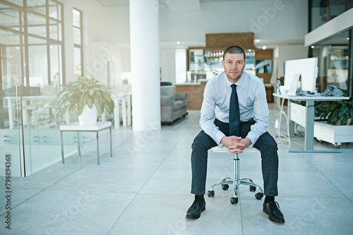 Portrait, chair and businessman in office for relax, happy and corporate employee in workplace. Smile, sales and consultant for interview at retail agency, employment and job opportunity meeting © peopleimages.com