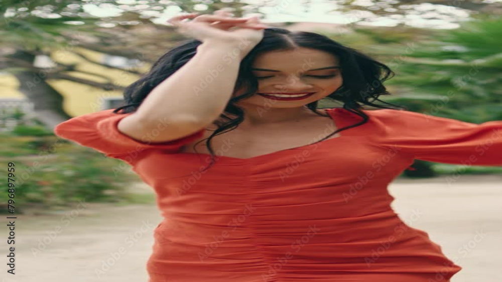Sexy woman dancer moving body in green garden vertical. Seductive girl dancing Sexy woman dancer moving body in green garden vertical. Seductive girl dancing