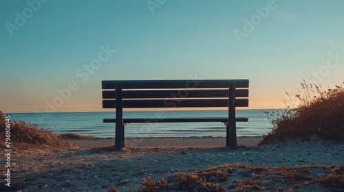  A wooden bench atop a sandy beach, facing the vast ocean, with a distant view