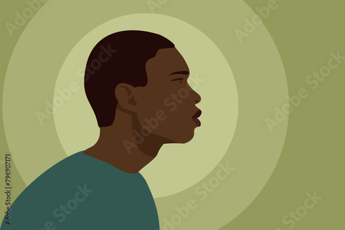 A black young man in profile. The man is a side view. African American people head. Portrait of a man in the flat style. Vector color illustration for printing.