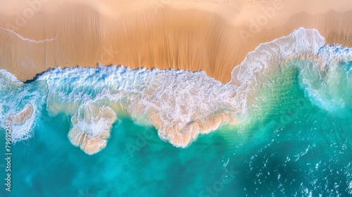  waves collide with the shore  revealing a sandy beach beyond