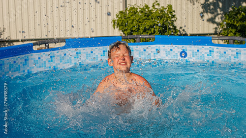 A happy boy is swimming in the pool. Swimming. Healthy lifestyle.