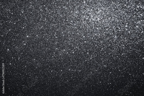 Black glitter texture shiny background. Twinkling glitter wallpaper