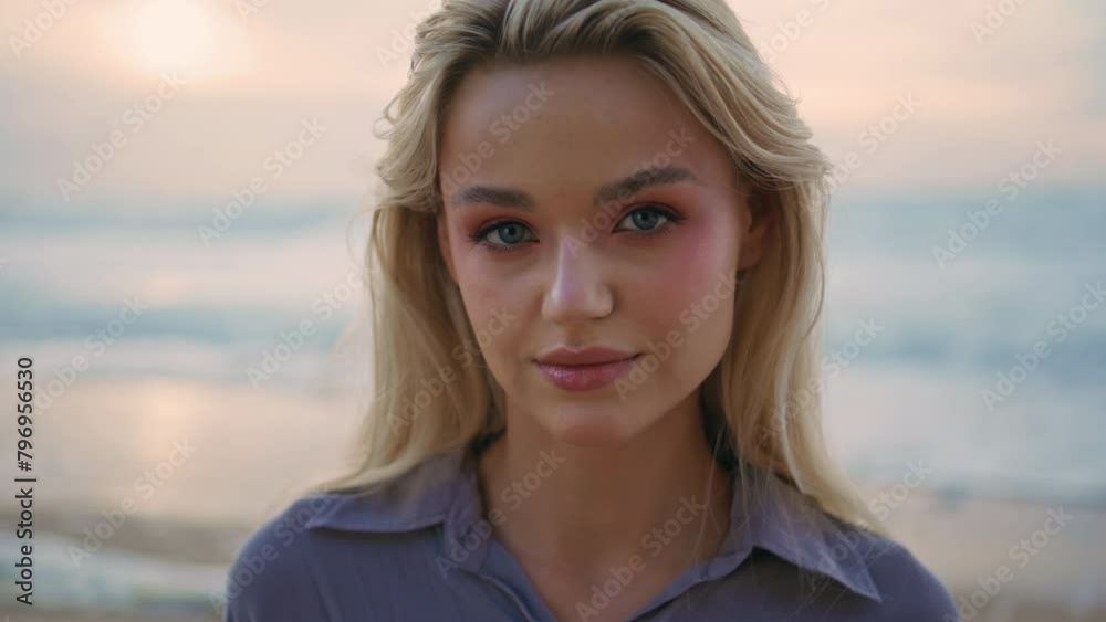Portrait summer girl shore on beautiful evening. Smiling pretty traveler posing Portrait summer girl shore on beautiful evening. Smiling pretty traveler posing