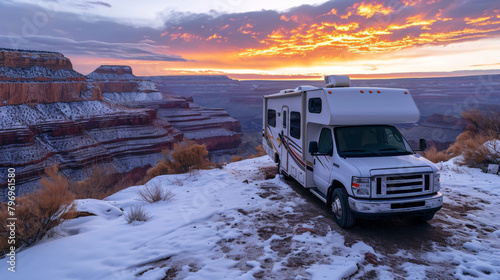 RV truck in snow field in winter in rugged land.