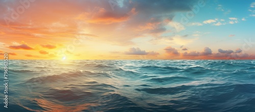 Sunset over the sea with waves and clouds