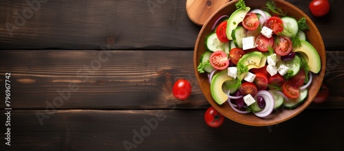 Wooden bowl full salad sliced tomatoes