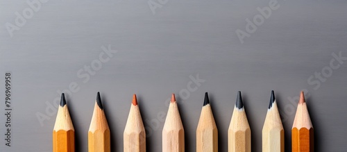 Pencils lined up, one stands out