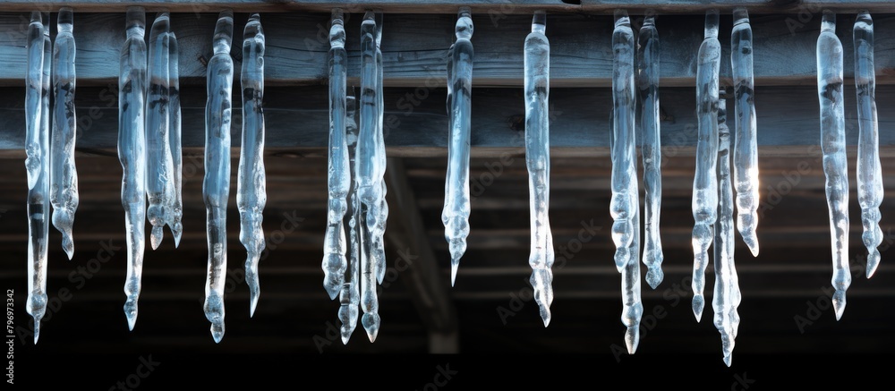 Icicles hang roof dark room Icicles hang roof dark room