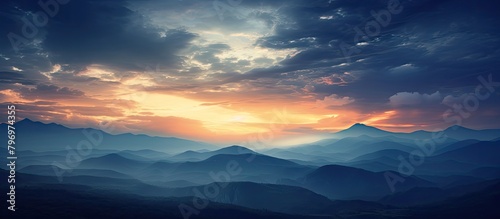 Mountains silhouetted against a setting sun
