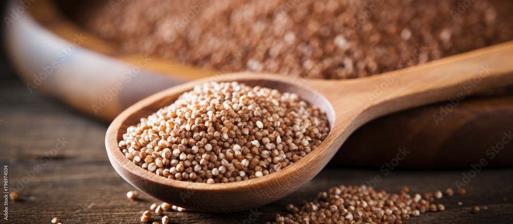 Wooden ladle with overflowing brown grains Wooden ladle with overflowing brown grains