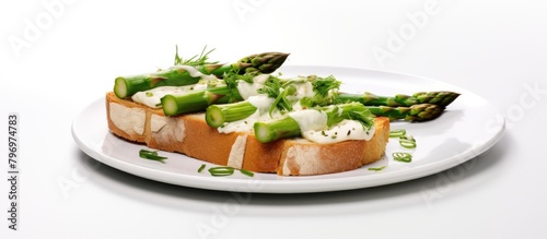 Sandwich with asparagus and cream on a plate