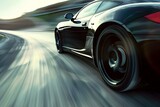 Blurry black sports car speeding down road creating motion blur effect. Concept Sports Car, Speeding, Motion Blur, Black, Road