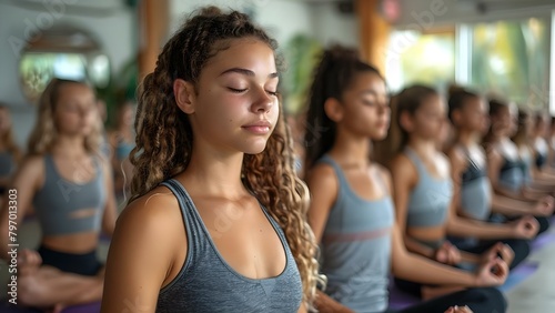 Closeup of young people practicing yoga with instructor in Sukhasana pose. Concept Yoga Class, Sukhasana Pose, Closeup Shots, Young People, Instructor