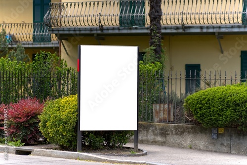 White billboard vertically on a street in Chiasso, Switzerland.