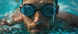 Man Swimming in Pool With Goggles