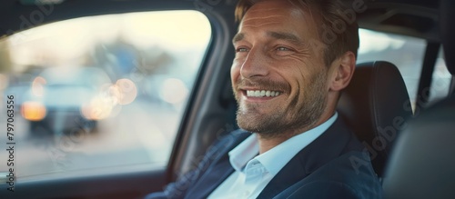 Man Sitting in Car Smiling photo